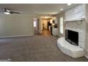 Open living room with views into the kitchen and a stone fireplace at 3869 Rosedale Ln, Douglasville, GA 30135