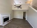 Two story living room with loft and fireplace at 9585 Lakeview Cir, Union City, GA 30291