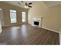 Bright living room features a fireplace and hardwood floors at 9585 Lakeview Cir, Union City, GA 30291