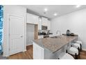 Modern kitchen with granite countertops and stainless steel appliances at 1918 Schoolhouse Ln # 8, Temple, GA 30179