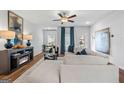 Spacious living room with hardwood floors, fireplace, and large windows at 1923 School House Ln, Temple, GA 30179