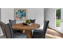 Dining room features a round wooden table with four chairs at 1923 School House Ln, Temple, GA 30179