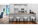 Modern kitchen with granite countertops and white cabinets at 1923 School House Ln, Temple, GA 30179