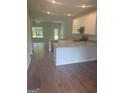 Open concept kitchen with hardwood floors at 1920 Schoolhouse Ln # 9, Temple, GA 30179