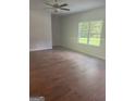Spacious living room with hardwood floors and large windows at 1921 School House Ln, Temple, GA 30179