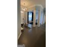 Bright and spacious entryway with high ceilings and columns at 938 Mulberry Fields Cv, Auburn, GA 30011