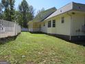 Yellow sided home with large backyard at 402 Thurman Rd, Stockbridge, GA 30281