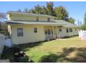 Rear view of yellow sided home at 402 Thurman Rd, Stockbridge, GA 30281