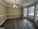 Bright dining room with bay window and hardwood floors at 508 Wynbrooke Pkwy, Stone Mountain, GA 30087