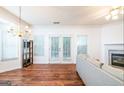 Living room with hardwood floors, fireplace, and access to backyard at 5490 Hampton Ct, Atlanta, GA 30349