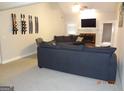 Living room with fireplace and built-in shelving at 2958 Mary Alice Trl, Loganville, GA 30052