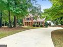 Two-story home with driveway and landscaping at 920 Eskew Rd, Mcdonough, GA 30252