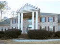 Brick house with columns, a grand entrance and manicured landscaping at 5335 Saville Dr, Acworth, GA 30101