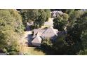 Aerial view of house, showcasing backyard, driveway and surrounding trees at 5335 Saville Dr, Acworth, GA 30101