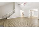 Living room with hardwood floors and staircase at 195 Pine Branch Dr, Stockbridge, GA 30281