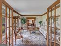 Bright living room featuring hardwood floors and ample natural light at 655 Mcdonough Rd, Hampton, GA 30228