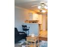 Kitchen with white cabinets, a breakfast bar, and modern appliances at 12 Intown Pl, Fayetteville, GA 30214