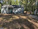 Blue house with white accents and landscaping at 1901 Maywood Nw Pl, Atlanta, GA 30318