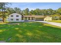 Mid-century modern style home with a large yard at 1785 Enid Dr, Lithonia, GA 30058