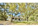 Beautiful house with a large front porch and mature trees at 1471 Centennial Rd, Rutledge, GA 30663