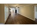 Spacious living area with hardwood floors and French doors leading to patio at 3107 Cherry Blossom Ln, East Point, GA 30344