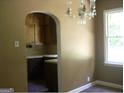 Dining room with an archway opening to the kitchen at 2945 Palm Dr, East Point, GA 30344