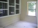 Bright sunroom with large windows and wood flooring at 2945 Palm Dr, East Point, GA 30344