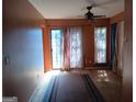 Bright living room with sliding glass door and carpet at 845 Heritage Oaks Dr, Stone Mountain, GA 30088