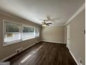 Spacious living room featuring hardwood floors and large windows at 739 Yale Sw Pl, Atlanta, GA 30315
