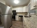 Kitchen with granite countertops and stainless steel appliances at 362 Ard Nw Pl, Atlanta, GA 30331