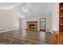 Spacious living room with brick fireplace and wood floors at 115 Ridgewood Cir, Mcdonough, GA 30252