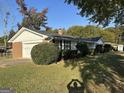 Ranch house with brick and vinyl siding, attached garage at 4634 Bexley Dr, Stone Mountain, GA 30083