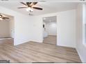 Bright living room with hardwood floors and ceiling fan at 3363 Delmar Nw Ln, Atlanta, GA 30331