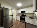 Modern kitchen with stainless steel appliances at 1154 Penn Ct, Atlanta, GA 30315