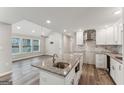 Modern kitchen featuring granite countertops and stainless steel appliances at 1872 Oakmont Nw Dr, Atlanta, GA 30314