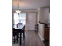 Bright dining area with hardwood floors and access to kitchen at 2628 Haligan Pointe, Riverdale, GA 30296