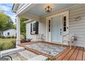 Inviting front porch with light blue door and two chairs, perfect for relaxing at 4130 Middlebrooks Ne St, Covington, GA 30014