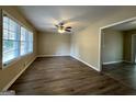 Bright living room with vinyl flooring and ceiling fan at 1581 Hollyhock Ter, Decatur, GA 30032