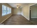 Bright living room featuring hardwood floors and a ceiling fan at 1581 Hollyhock Ter, Decatur, GA 30032