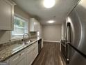 Modern kitchen featuring granite countertops and stainless steel appliances at 2019 W Flat Shoals Ter, Decatur, GA 30034