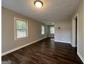 Spacious living room with hardwood floors and neutral walls at 2019 W Flat Shoals Ter, Decatur, GA 30034
