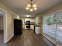 Modern kitchen with white cabinets, granite countertops, and stainless steel appliances at 1370 David Cir, Decatur, GA 30032