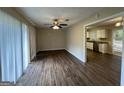 Bright dining room with hardwood floors and an open view to the kitchen at 1370 David Cir, Decatur, GA 30032