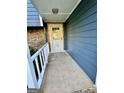 Front entrance with security door and railing at 6091 Katherine Rd, Rex, GA 30273