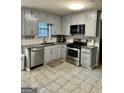 Kitchen with stainless steel appliances and granite countertops at 6091 Katherine Rd, Rex, GA 30273