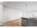 Modern kitchen with gray cabinets and granite countertops at 213 Fern Dale Dr # 119, Fairburn, GA 30213