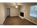 Living room with fireplace and wood-look floors at 3617 Collins Dr, Douglasville, GA 30135