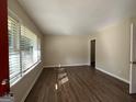 Bright living room with hardwood floors and large windows at 4778 Glenwood Rd, Decatur, GA 30035