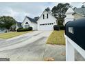 Two-story home with driveway and mailbox at 219 Turnbridge Cir, Peachtree City, GA 30269