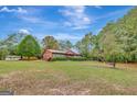 Brick ranch home on a large lot with mature trees at 115 Bernhard Rd, Fayetteville, GA 30215